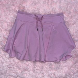 Pink tennis sports skirt with built-in shorts